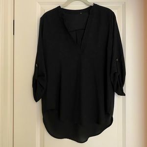 Lush black roll-tab sleeve hi-low tunic blouse